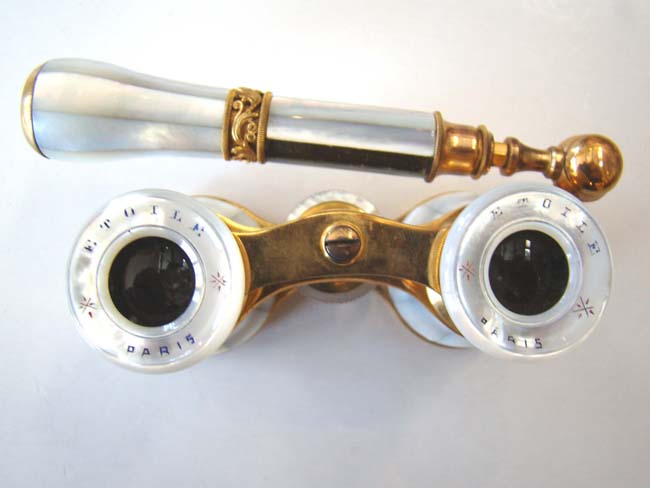 A very fine pair of late 19th century French Opera Glasses with folding handle